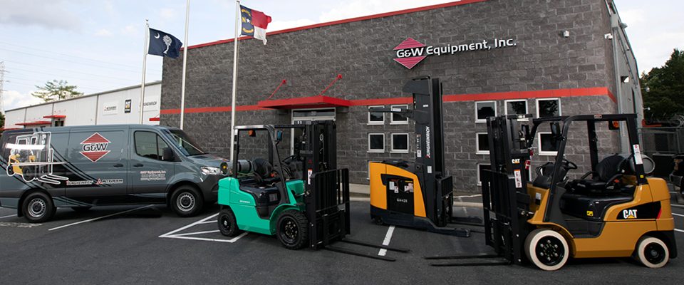 Forklifts and service van outside of G&W Equipment location